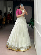 Charming Off-White Tiered Georgette Chaniya Choli with Magenta Brocade Blouse & Saree Drape
