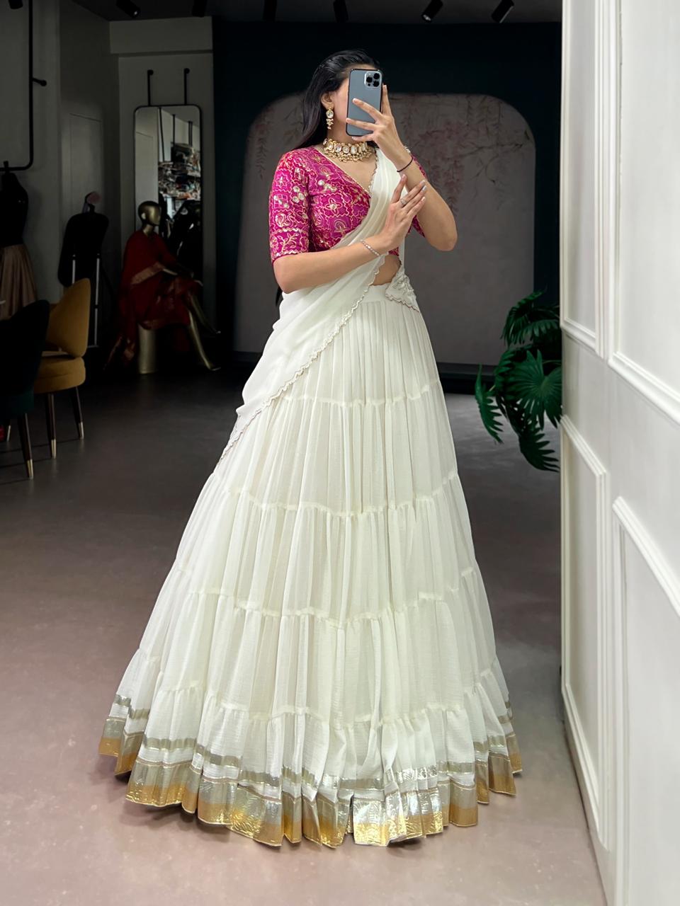 Charming Off-White Tiered Georgette Chaniya Choli with Magenta Brocade Blouse & Saree Drape