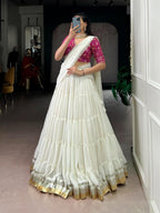 Charming Off-White Tiered Georgette Chaniya Choli with Magenta Brocade Blouse & Saree Drape