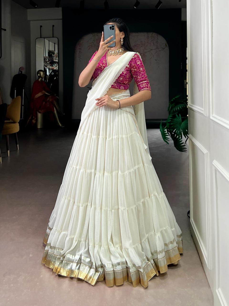 Charming Off-White Tiered Georgette Chaniya Choli with Magenta Brocade Blouse & Saree Drape