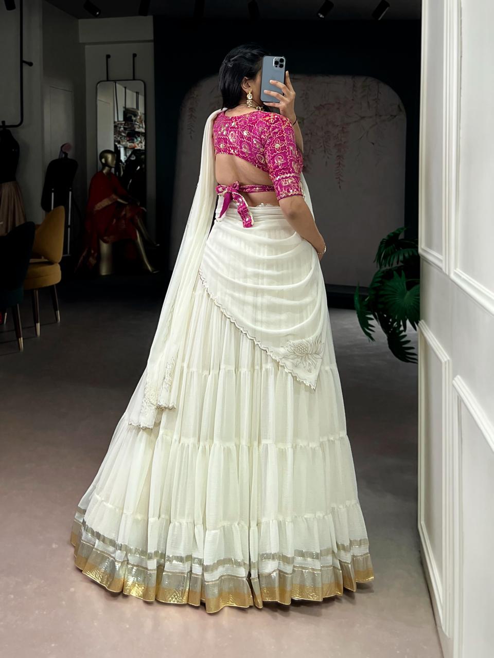 Charming Off-White Tiered Georgette Chaniya Choli with Magenta Brocade Blouse & Saree Drape