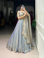 Stunning Ice Blue Metallic Tissue Silk Chaniya Choli with Scalloped Gold Zari Border