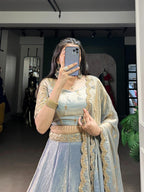 Stunning Ice Blue Metallic Tissue Silk Chaniya Choli with Scalloped Gold Zari Border
