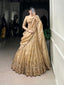 Model showcasing a premium imperial metallic gold tissue silk Chaniya Choli featuring a heavy woven gold zari border with palace arches, an elegant elbow-length sleeve choli, and a scalloped border dupatta inside a boutique.